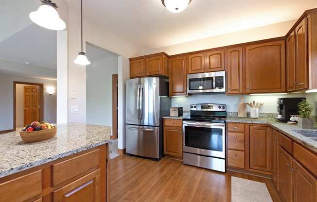 Laurel East End Apartments in Golden Valley, MN photo of a full kitchen with stainless steel appliances and granite counter tops