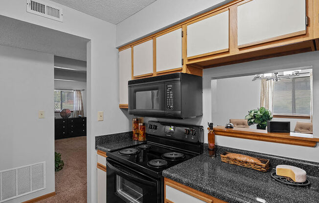 a kitchen with a bunch of microwaves in it