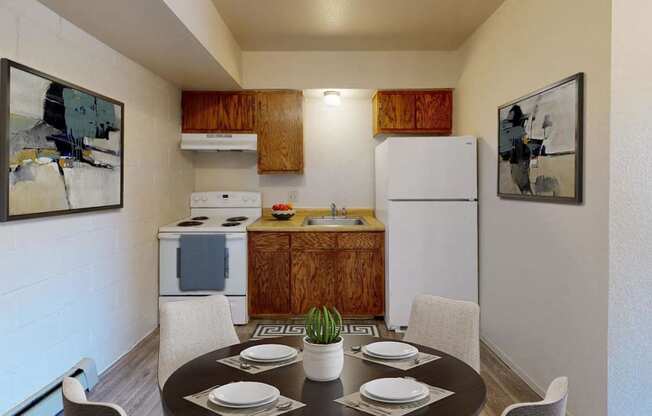 a kitchen and dining room with a table and chairs