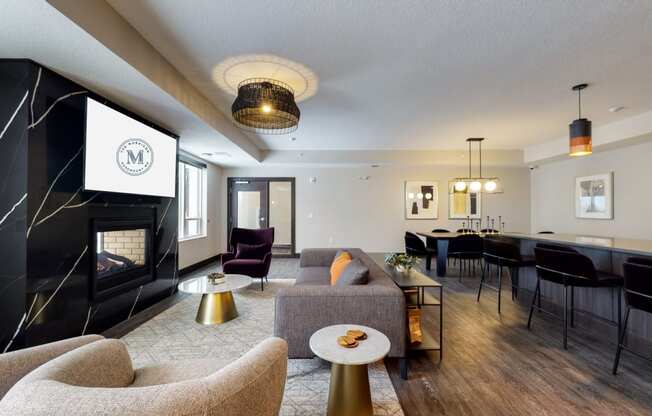 a living room filled with furniture and a fire place
