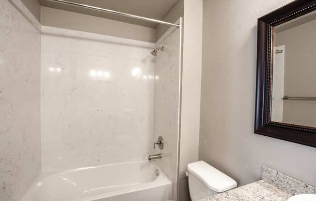 View of bathroom with tub shower combo