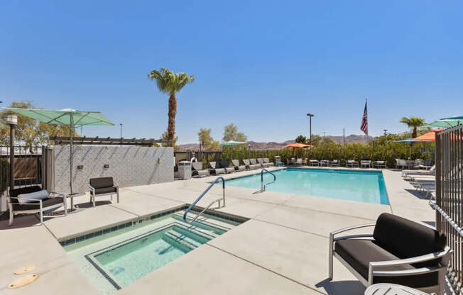 A pool with a slide and a palm tree in the background.
