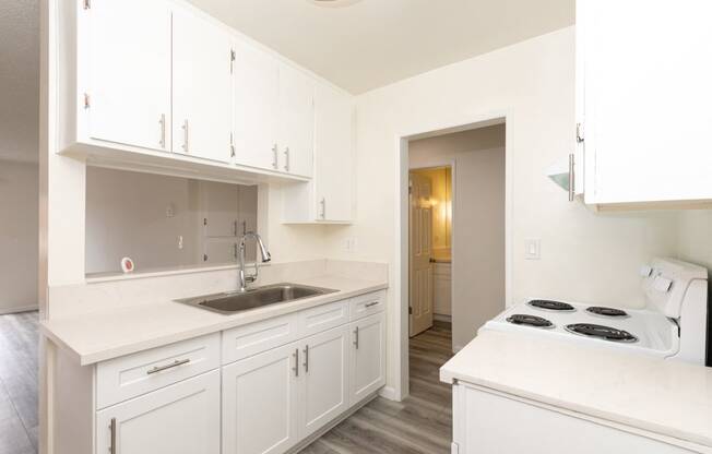 Kitchen with White Appliances and White Cabinets