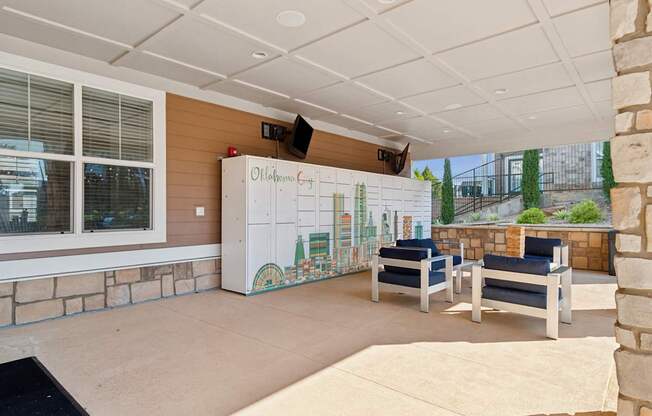 A room with a whiteboard and a stone wall.