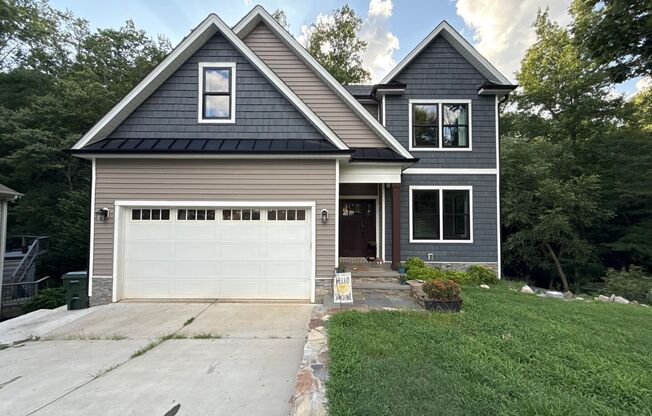 Incredible 5BD, 4.5BA Wake Forest Home Near Falls Lake with a Fully Finished Basement Living Space and a Backyard Haven Including a Large Deck, Fire Pit, and Creek