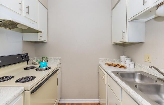 a kitchen with a stove and a sink