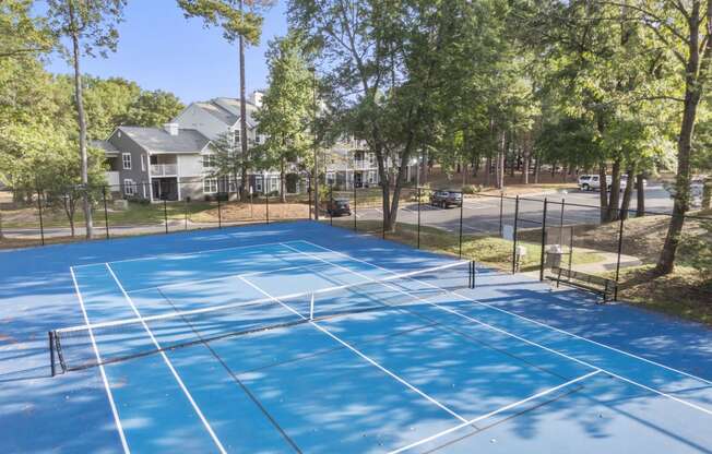 the tennis courts at the whispering winds apartments in pearland at Trails at Short Pump Apartments, Richmond, 23233