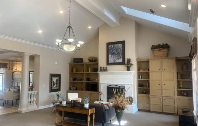 a living room with a fireplace and a table