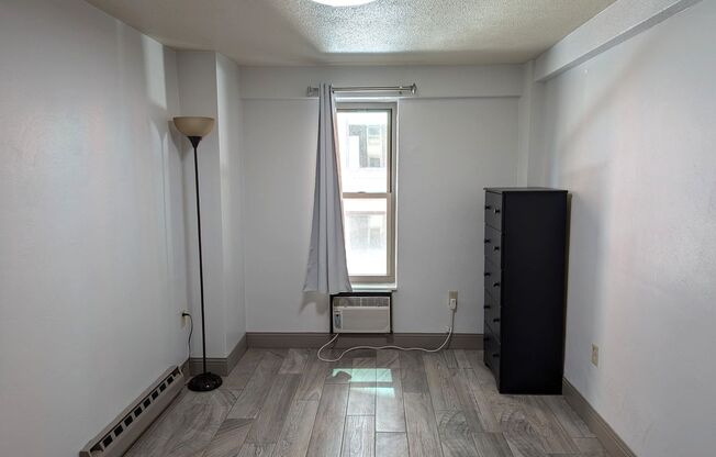 High Rise Living Directly Across the Street from Campus!