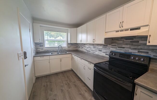 Cute and Cozy, Centrally Located Triplex with Yard