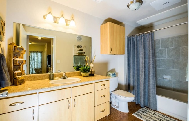 a bathroom with a sink toilet and shower at Villa Espada Apartments, San Antonio