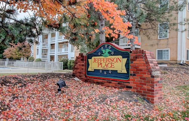 Image of Jefferson Place East sign with trees