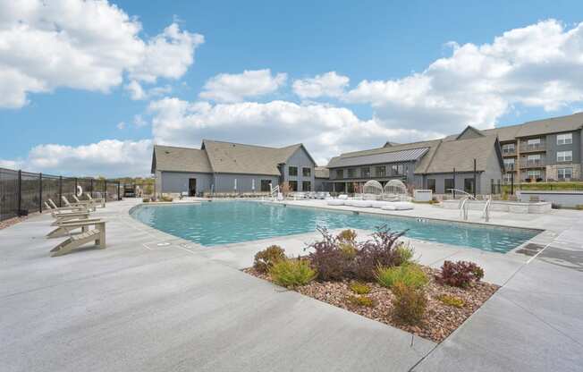 a rendering of a swimming pool with buildings in the background