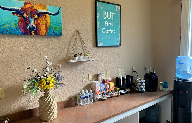 a counter with a vase of flowers on top of it