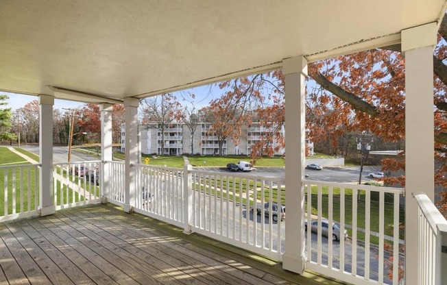 a porch with a view of a parking lot