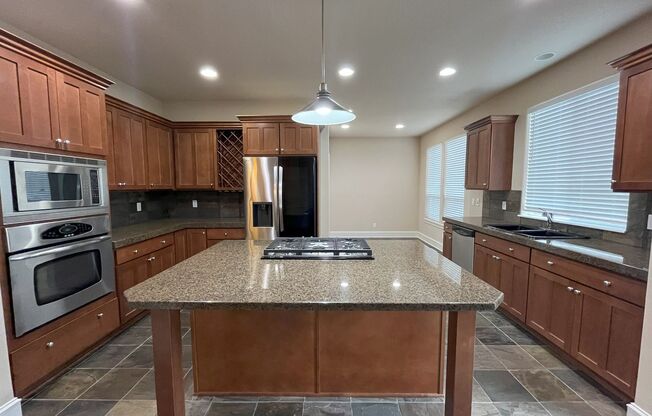 Elegant 4-Bed, 2.5-Bath Home with Gourmet Kitchen, Expansive Primary Suite & Lush Backyard Retreat