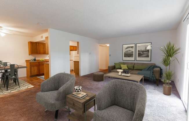 Living Room With Kitchen View at Candlewyck Apartments, Kalamazoo, MI, 49001