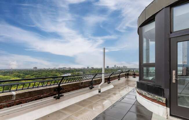 the view of the city from the balcony of a condo