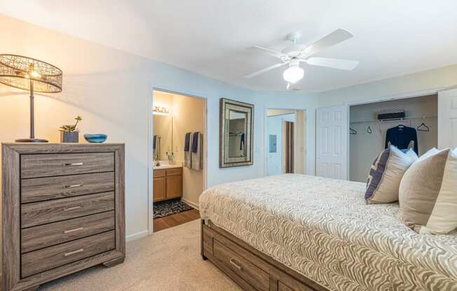 Bedroom with views into the bathroom and closet