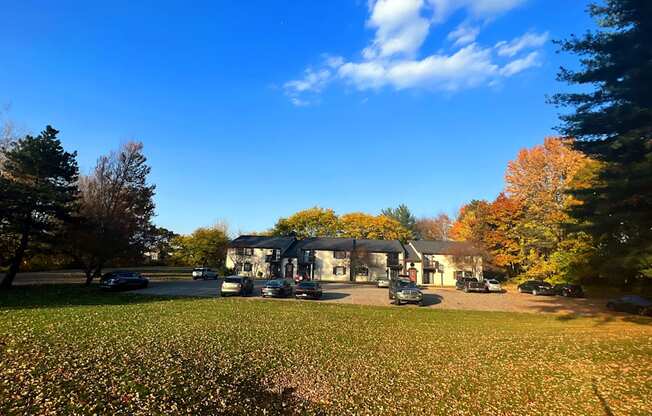 a house with a carport and a lawn in front of it