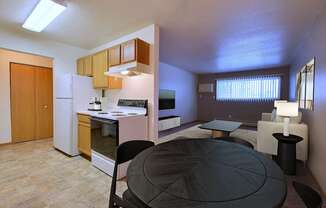 Fargo, ND Dakota Manor Apartments. a kitchen and dining area in a 555 waverly unit