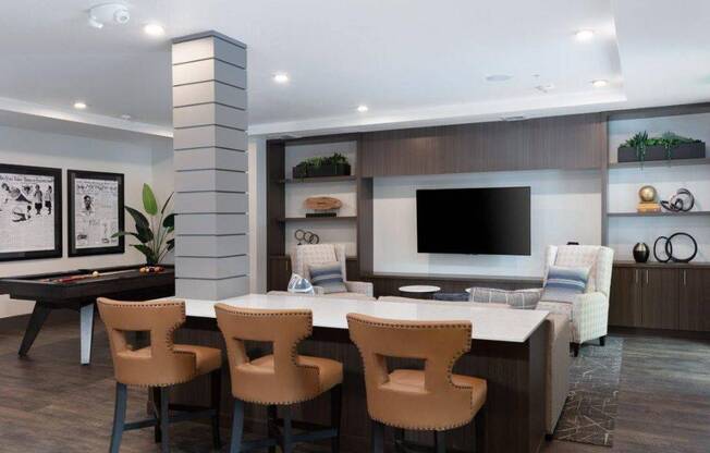 a living room with a table and chairs and a television