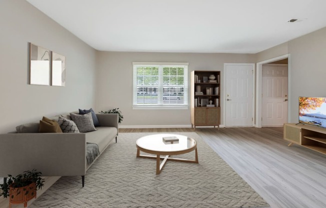 a living room with a couch and a coffee table