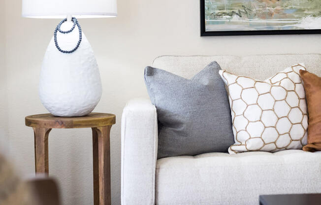 a living room with a couch and a lamp