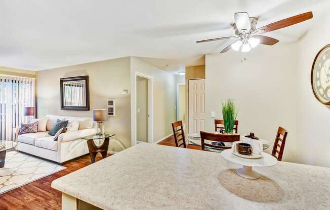 A dining room with a table set for two.