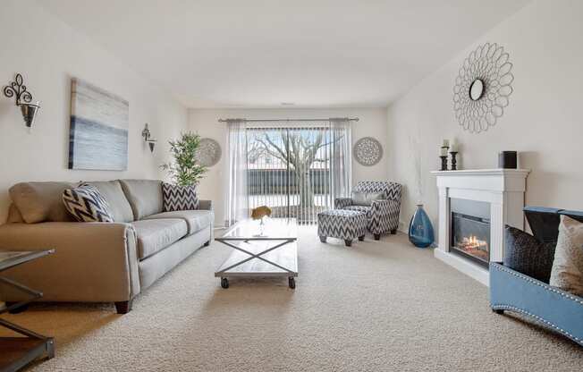 Living Room with Sliding Glass Door at Lakeside Village Apartments Clinton Township MI