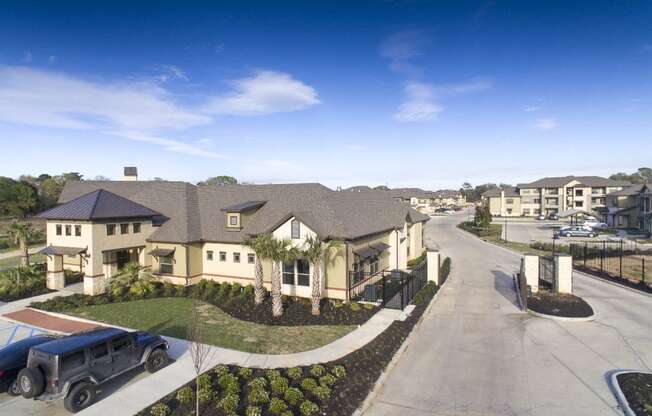 an aerial view of a group of houses in a parking lot