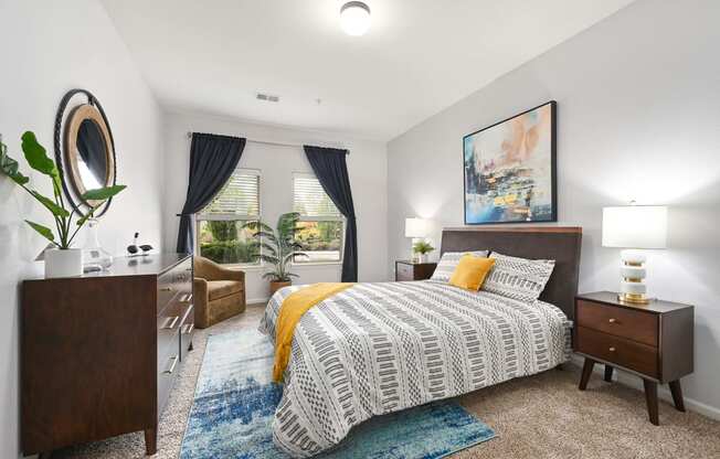 a bedroom with a bed and a window at Sovereign at Overland Park, Overland Park, KS  