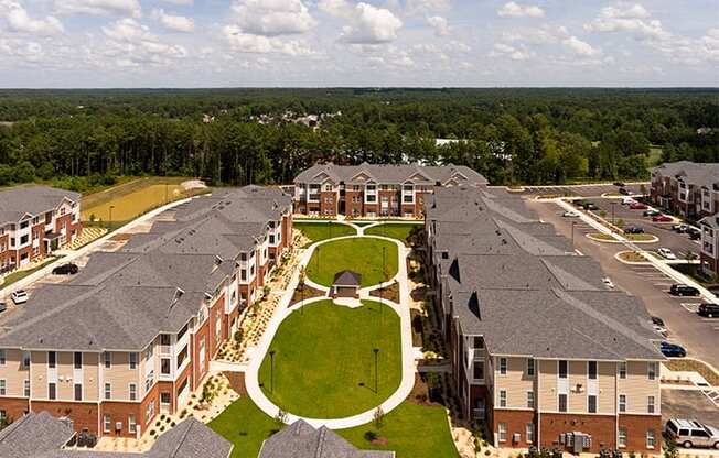 Aerial view of apartment buildings with paved pathways throughout