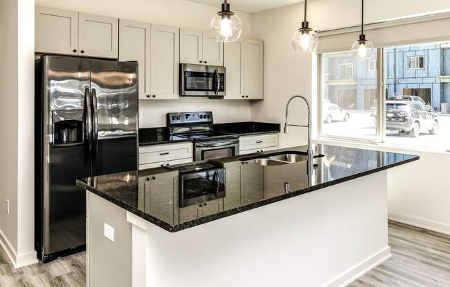 Large stylish kitchens with stainless steel appliances at Edge 204 Apartments in Omaha, NE