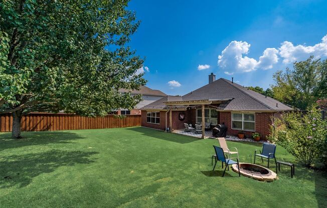 A must see Garland home in Rustic Oaks!!