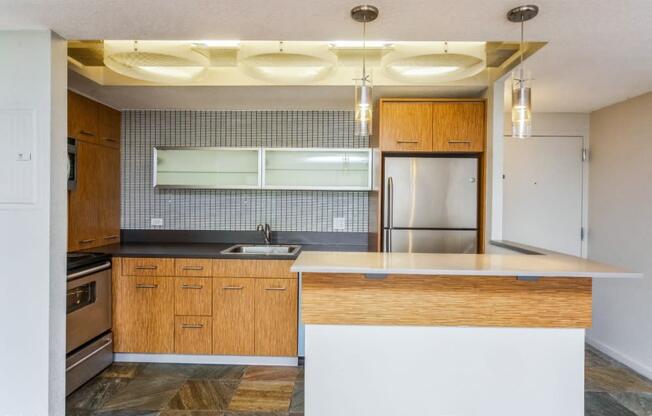 Chic accents in the upgraded kitchen including pendant lighting over the breakfast bar