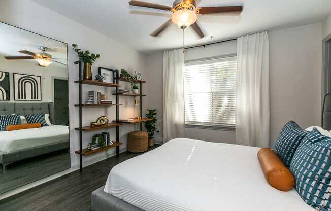 a bedroom with a bed and a ceiling fan at Briarcliff Apartments, Atlanta, GA, 30329