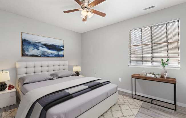 Bedroom with window, bed, and table at Eddingham in Lawrence, KS