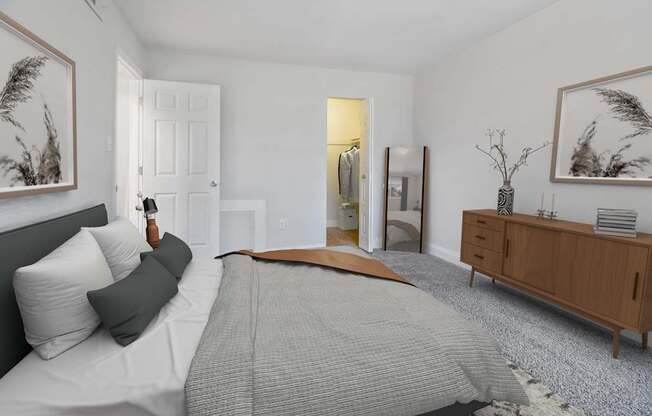 A bedroom with a large bed and a wooden dresser.
