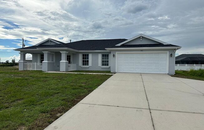 Spacious 3-Bed + Den Home with 2-Car Garage in NE Cape Coral. Special Offer! Qualify for a deposit-free option and save on move-in costs!