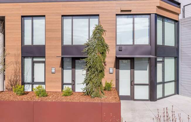 a tree in front of a building at Marina Square, Washington, 98337