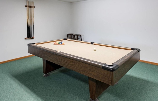 a pool table in a room with a