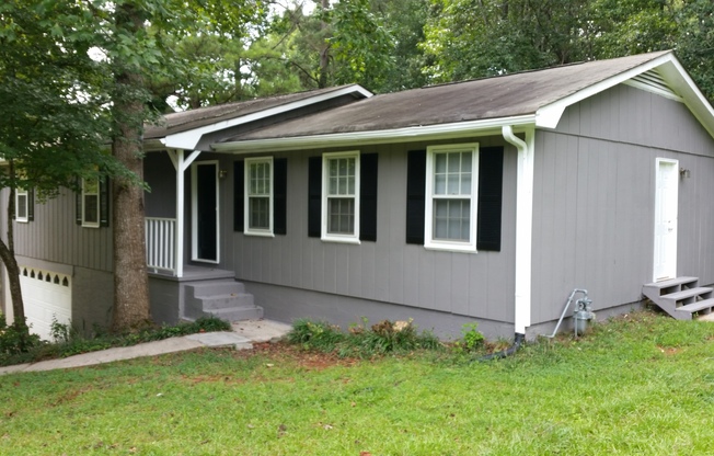 Natural Setting 5 bedroom 2 bath with finished basement home in Winston, GA