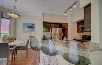 a kitchen and dining area in a 555 waverly unit