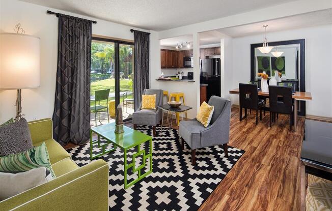 Spacious living area with private patio access at Creekfront at Deerwood, Florida