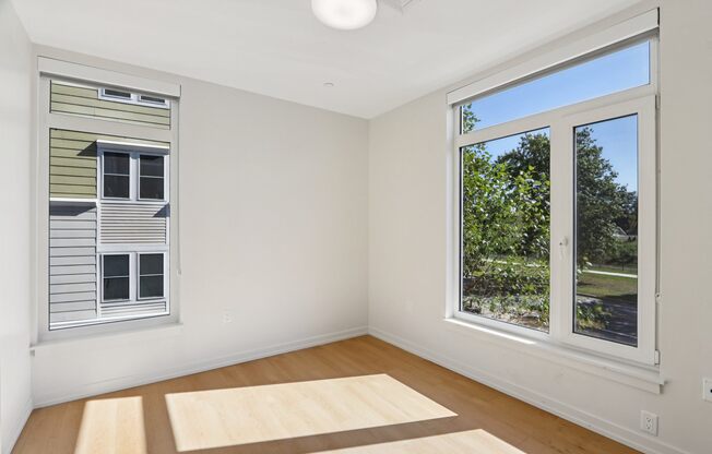 Bedroom with Oversized windows at Park77 Apartments, Cambridge, Massachusetts, 02138