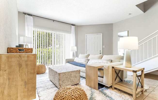 a living room with a couch and a table at Waterford Park Apartment Homes, LLC, Lauderhill Florida