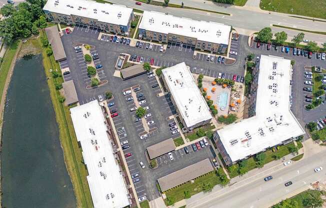 A parking lot with a building in the background.