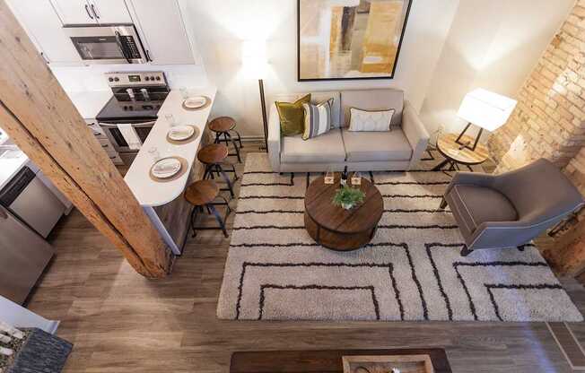 A modern kitchen with a white and wood theme.