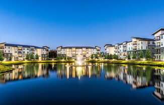 Fountain in the middle of a lake at Pearce at Pavilion Luxury Apartments, Riverview, FL